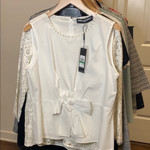 New White sleeveless shirt with pearls on neck